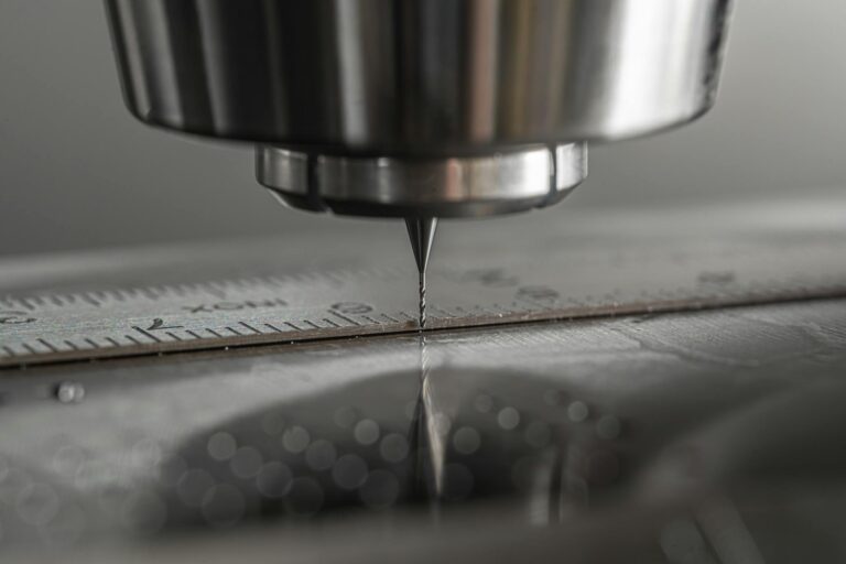 Detailed close-up of a CNC milling machine working on metal, showcasing precision and industry technology.