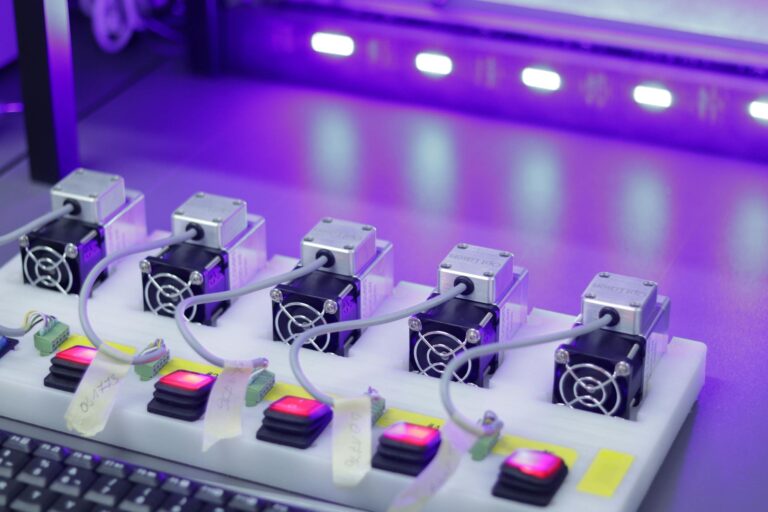 Detailed close-up of CNC laser units with glowing controls, ready for precision tasks.